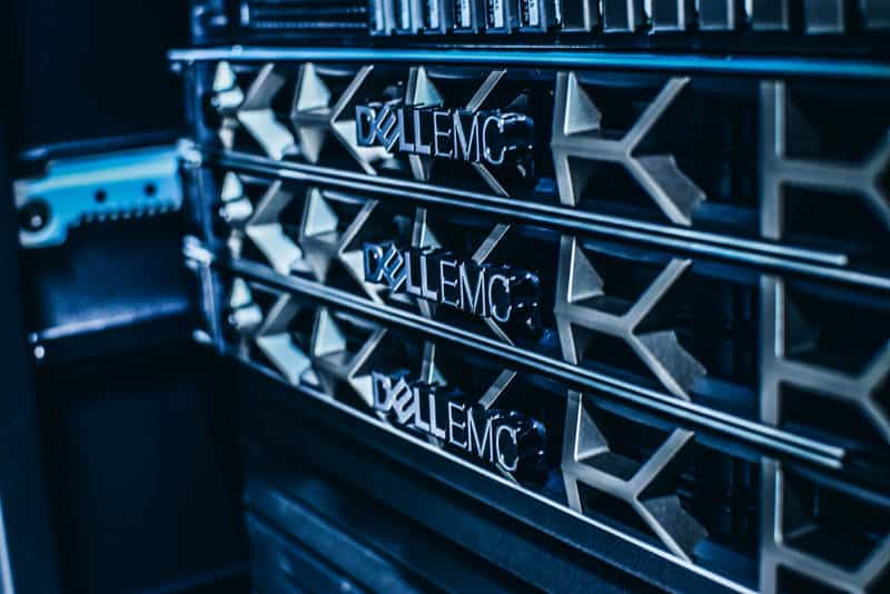 A close-up of a server rack with multiple units labeled with the brand 'DELL EMC'.